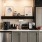 a kitchen with a shelf and cabinets