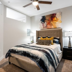 Relax and recharge in beautiful and spacious bedrooms a bedroom with a large mirror