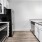 a kitchen with white cabinets