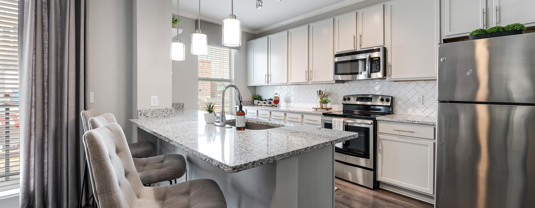 a kitchen with white cabinets