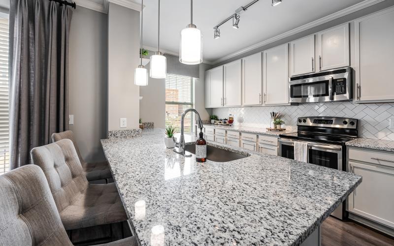 a kitchen with a marble countertop