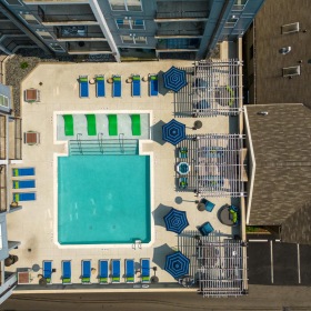 Settle into comfort at Infinity Midtown a group of buildings with a pool